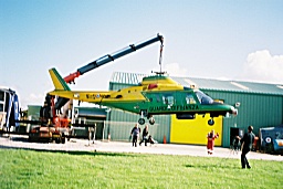 A109A II, GdiF-128, is lifted to the ground outside the Conservation Hangar. Photo by Greg Gregory.