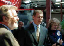 Prince Andrew prepares to unveil a plaque.