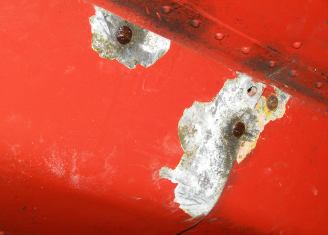 Corroded under-fuselage fairings.