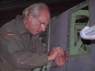 Roger prepares to attach a refurbished panel